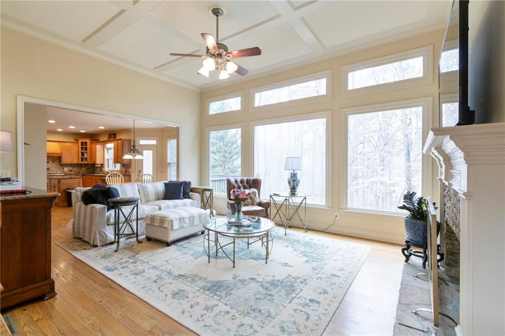 202 Davis Mill Road Ball Ground, GA 30107 - Photo 4 of 21 a living room with fireplace furniture and a large window