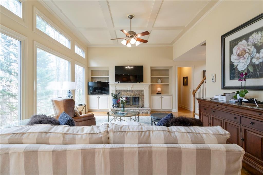 202 Davis Mill Road Ball Ground, GA 30107 - Photo 5 of 21 a living room with furniture a fireplace and a flat screen tv