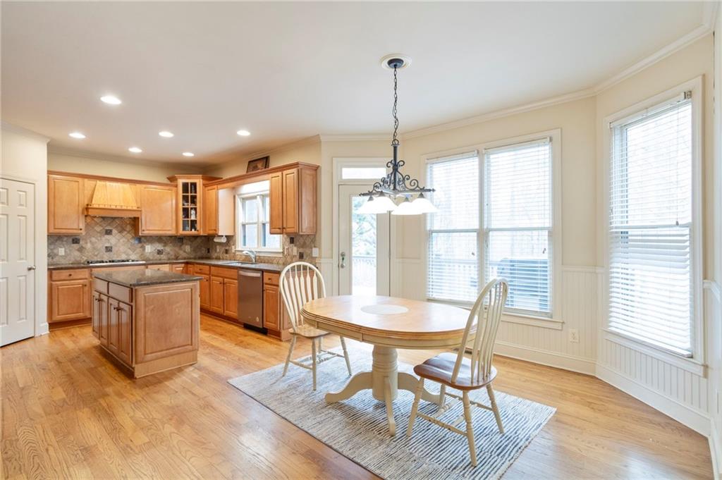 202 Davis Mill Road Ball Ground, GA 30107 - Photo 6 of 21 a view of a dining room and livingroom with furniture wooden floor a chandelier