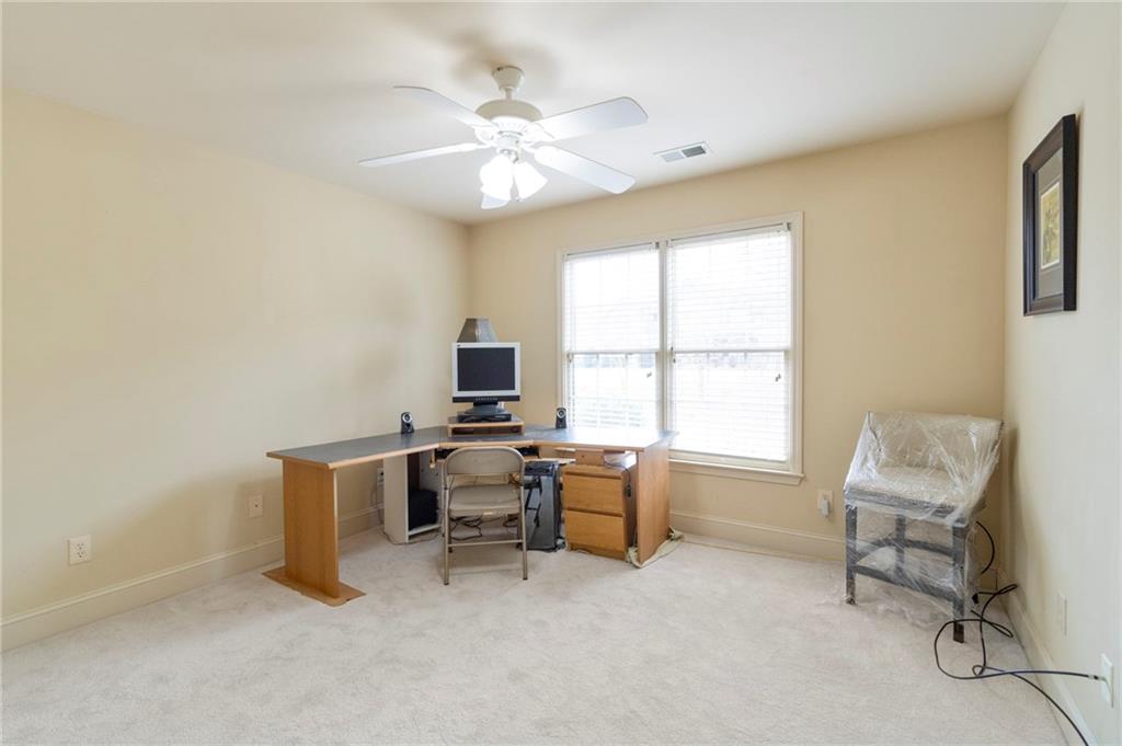 202 Davis Mill Road Ball Ground, GA 30107 - Photo 9 of 21 a view of a workspace with furniture and a window