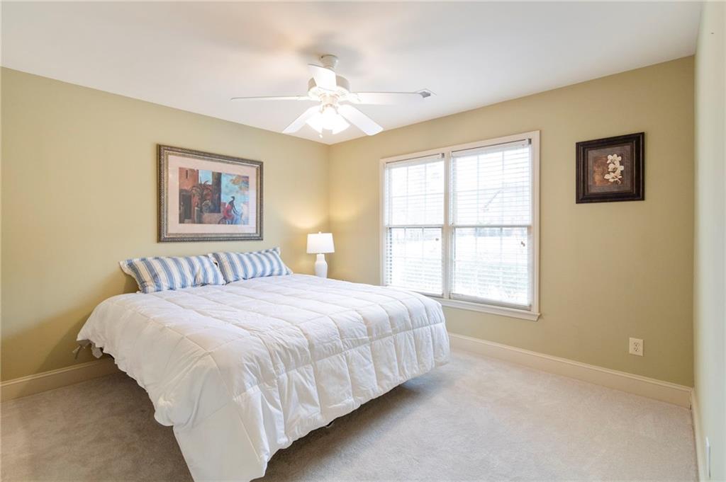 202 Davis Mill Road Ball Ground, GA 30107 - Photo 10 of 21 a bedroom with a bed and a window