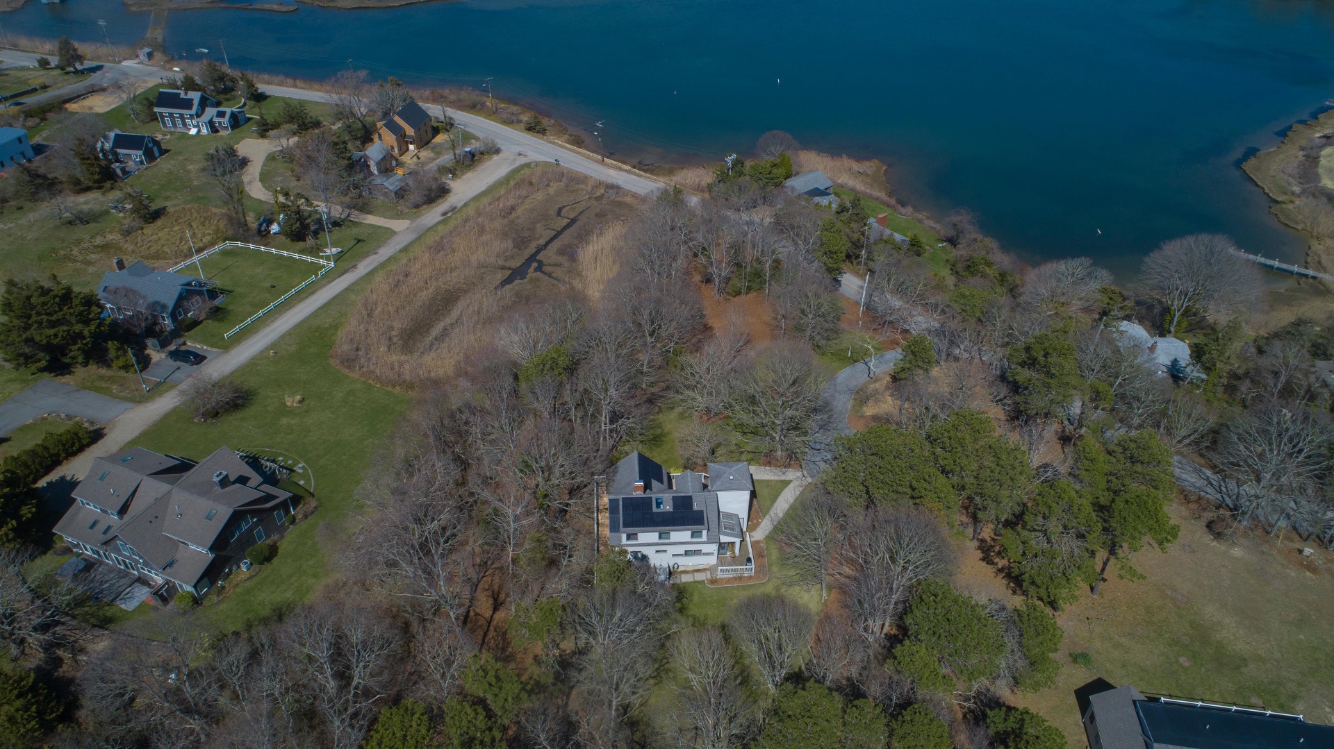 237 Lagoon Pond Road Vineyard Haven, MA 02568 - Photo 18 of 21 an aerial view of a house with a yard