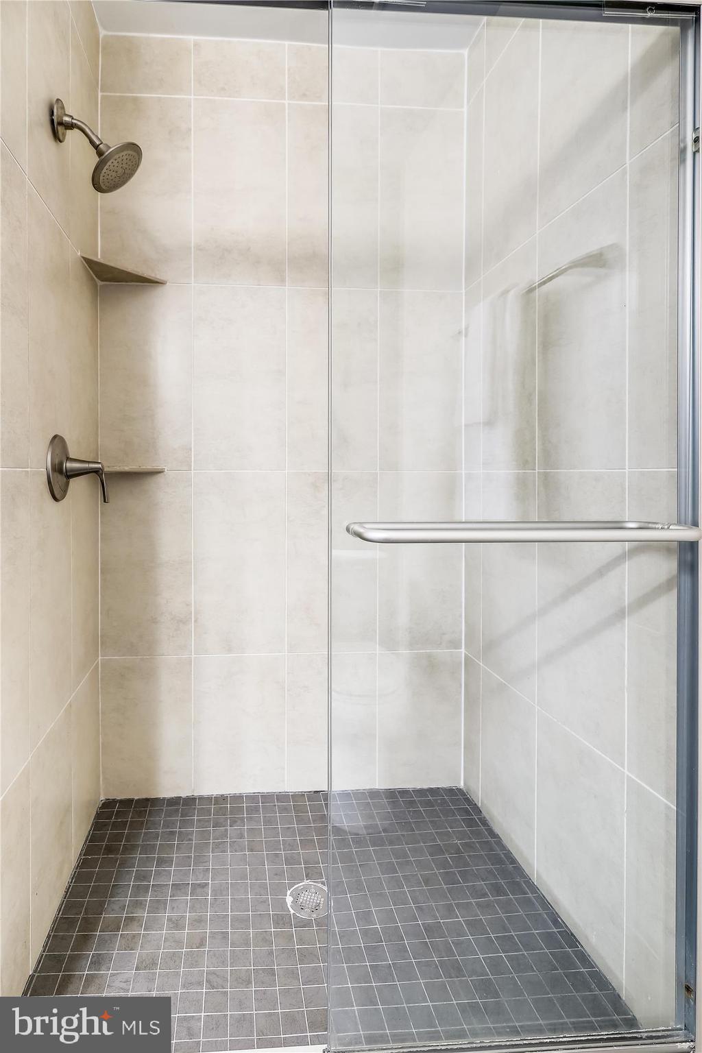 3005 Farm Road Alexandria, VA 22302 - Photo 26 of 59 a bathroom with a glass door shower