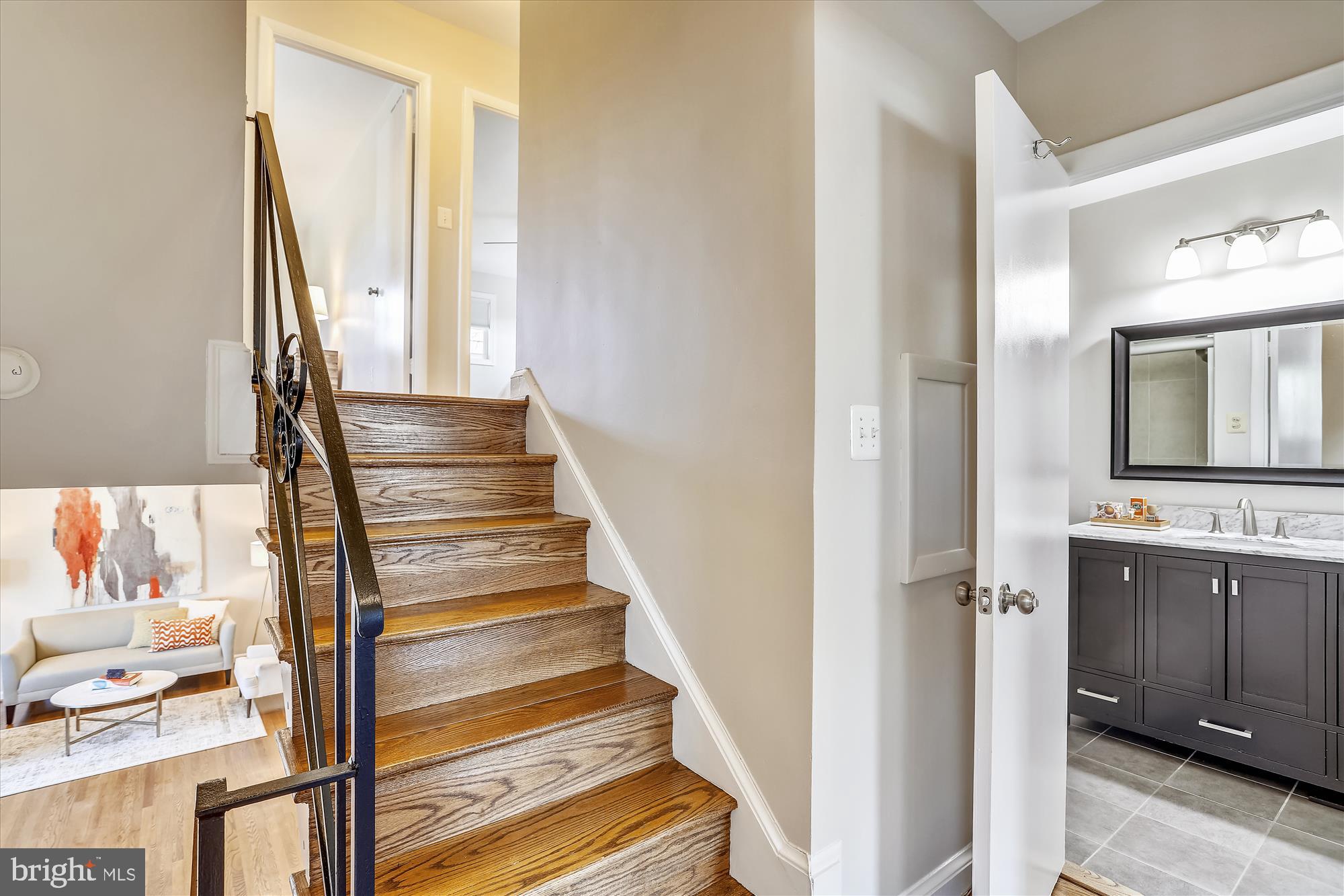 3005 Farm Road Alexandria, VA 22302 - Photo 30 of 59 a view of a hallway with wooden floor and staircase
