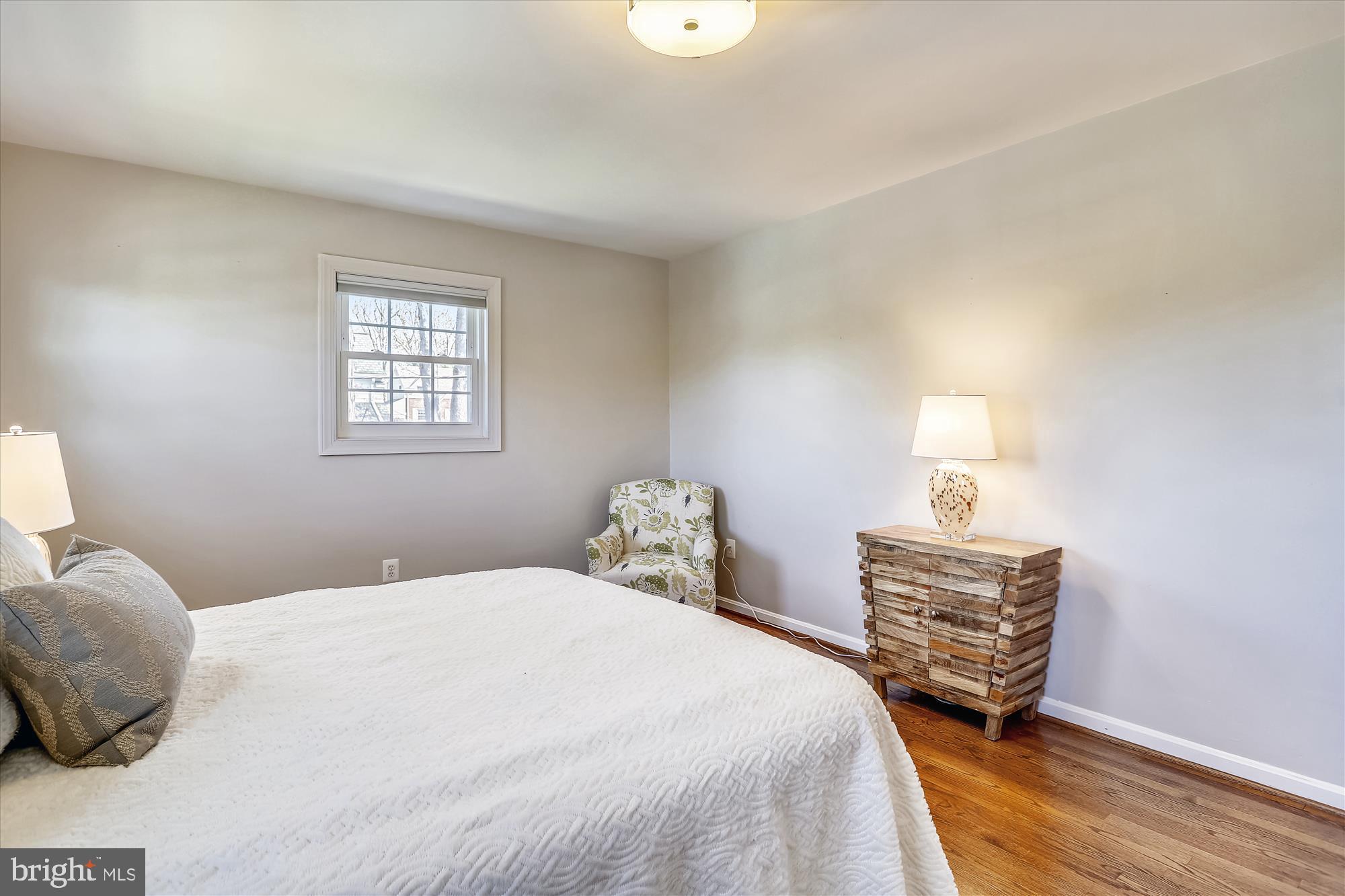 3005 Farm Road Alexandria, VA 22302 - Photo 32 of 59 a bedroom with a bed a dresser and a window