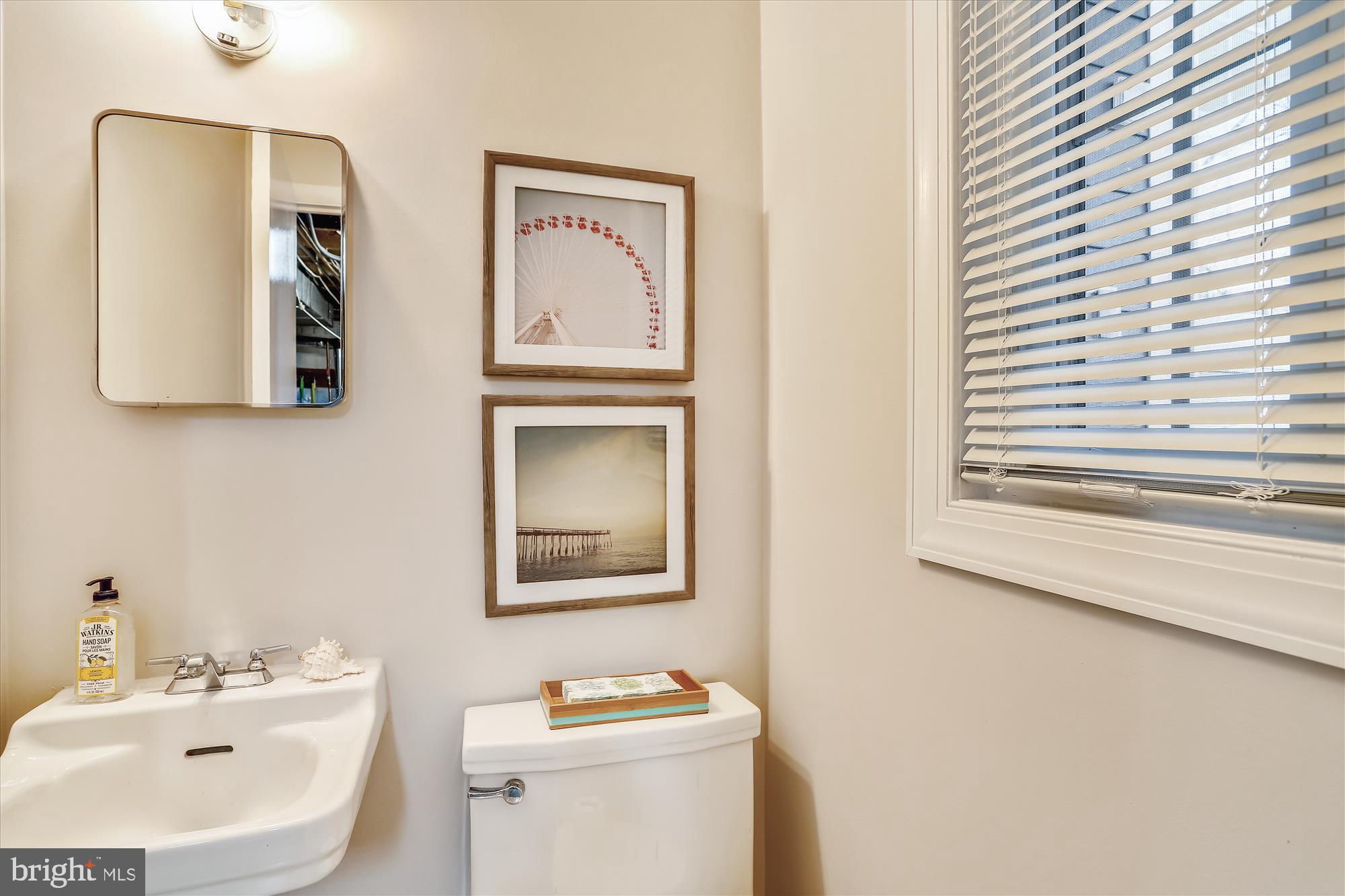 3005 Farm Road Alexandria, VA 22302 - Photo 42 of 59 a bathroom with a toilet sink and mirror