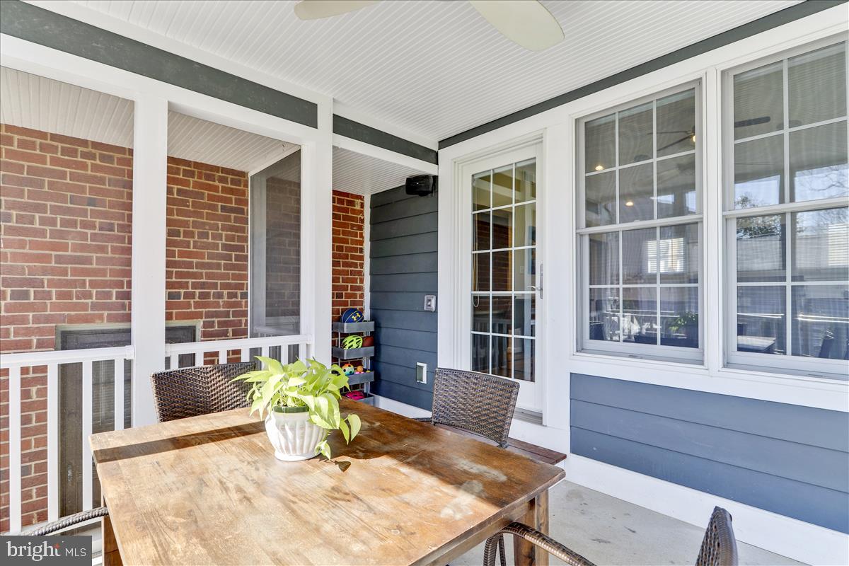 3005 Farm Road Alexandria, VA 22302 - Photo 48 of 59 a dining room with wooden floor and windows