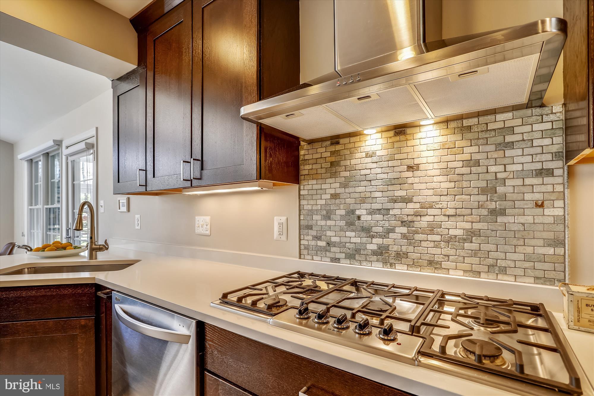 3005 Farm Road Alexandria, VA 22302 - Photo 10 of 59 a kitchen with wooden cabinets and a stove top oven