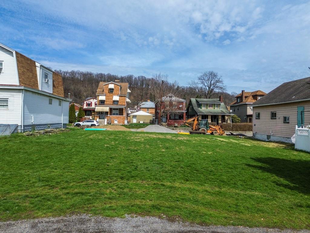 0 Russellwood Avenue McKees Rocks, PA 15136 - Photo 2 of 5 a view of a house with a big yard and sitting area