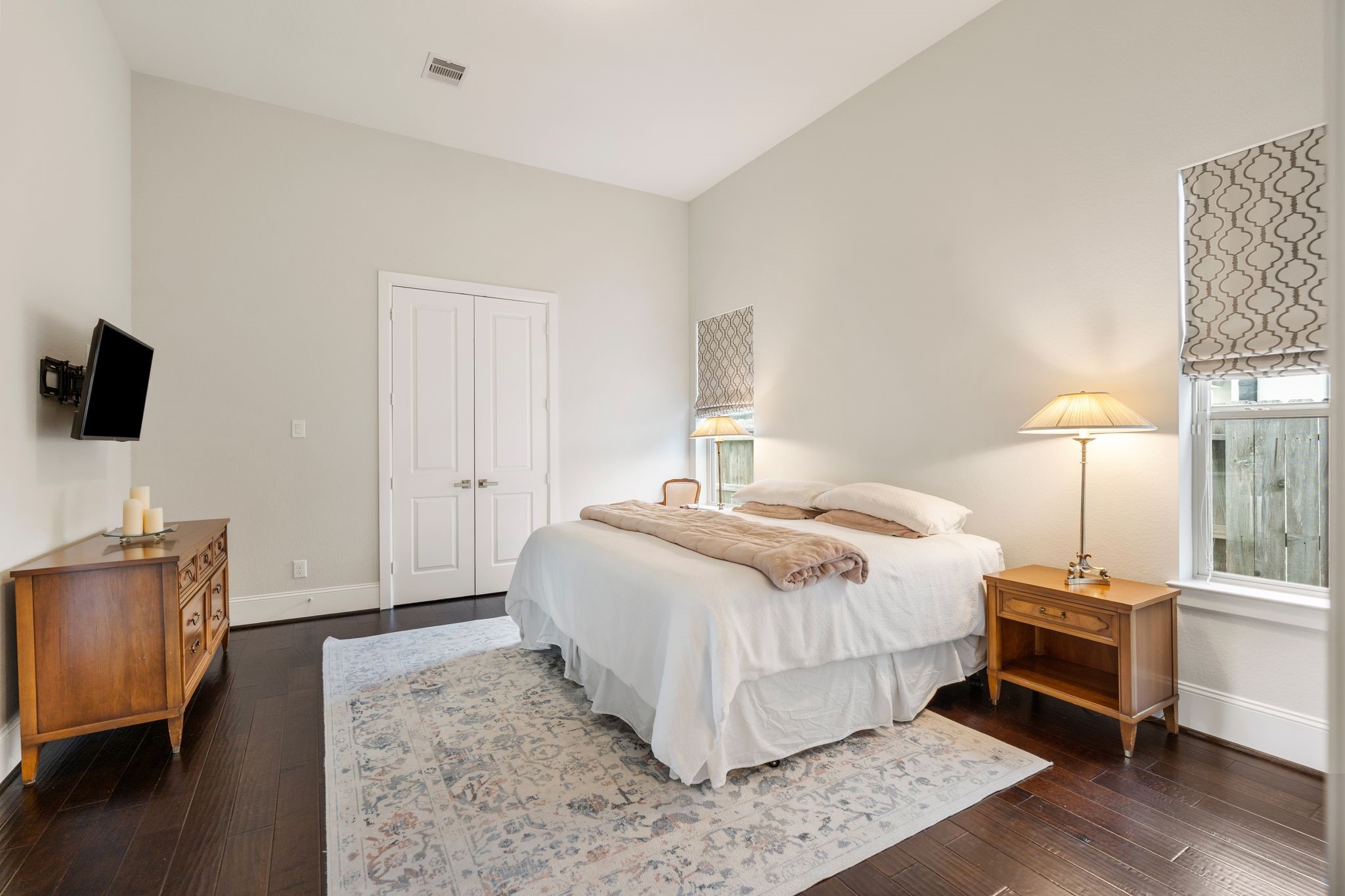 2926 Fairmont Ridge Lane Katy, TX 77494 - Photo 33 of 49 a bedroom with a bed and a flat tv screen on a dresser