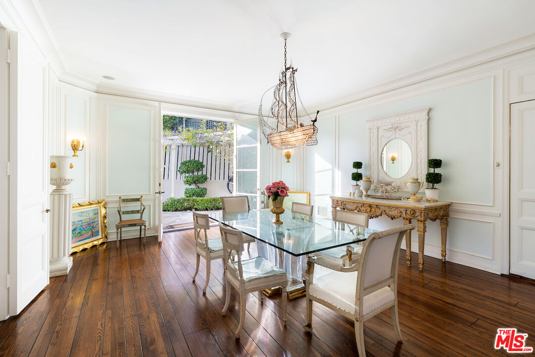 601 Woodruff Avenue Los Angeles, CA 90024 - Photo 11 of 39 a view of a dining room with furniture wooden floor and chandelier
