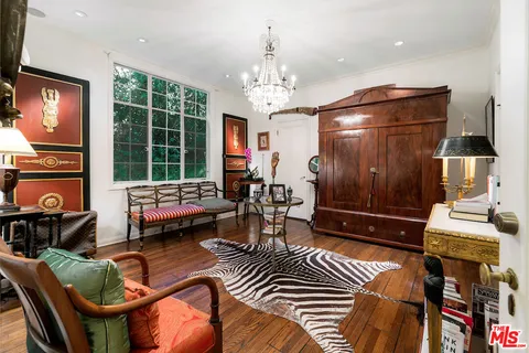 a view of a hallway with furniture and entryway