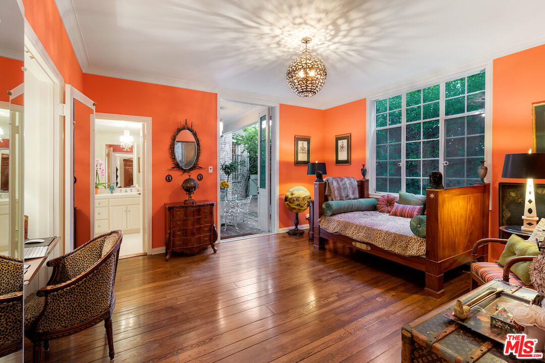 601 Woodruff Avenue Los Angeles, CA 90024 - Photo 28 of 39 a living room with furniture windows and a chandelier