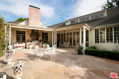 a view of a park with iron fence