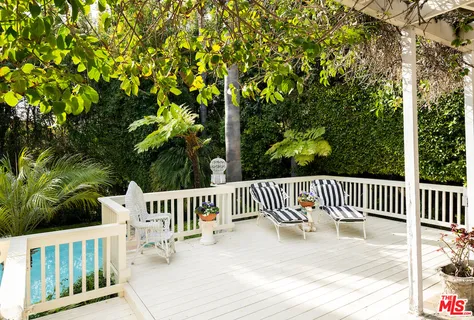 a view of a backyard with seating area