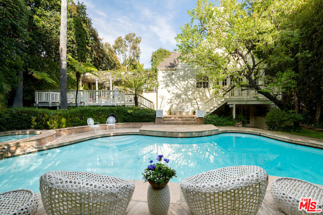 601 Woodruff Avenue Los Angeles, CA 90024 - Photo 36 of 39 a view of a swimming pool with a patio