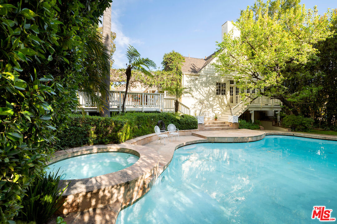 601 Woodruff Avenue Los Angeles, CA 90024 - Photo 37 of 39 a view of a swimming pool with a patio