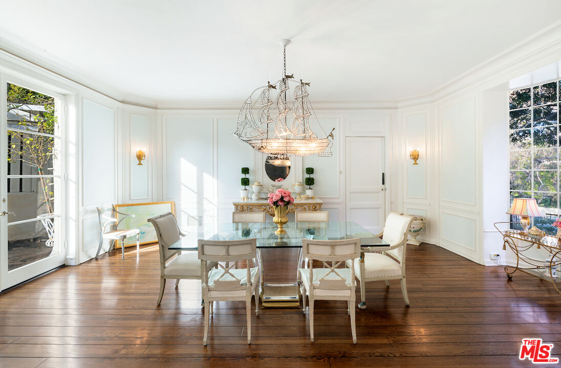 601 Woodruff Avenue Los Angeles, CA 90024 - Photo 10 of 39 a view of a dining room with furniture wooden floor and chandelier