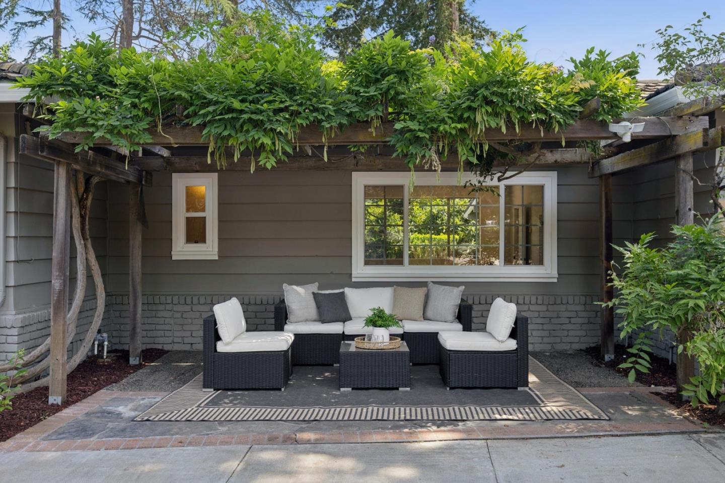 755 Santa Rita Avenue Los Altos, CA 94022 - Photo 4 of 50 a view of a patio with couches table and chairs and potted plants