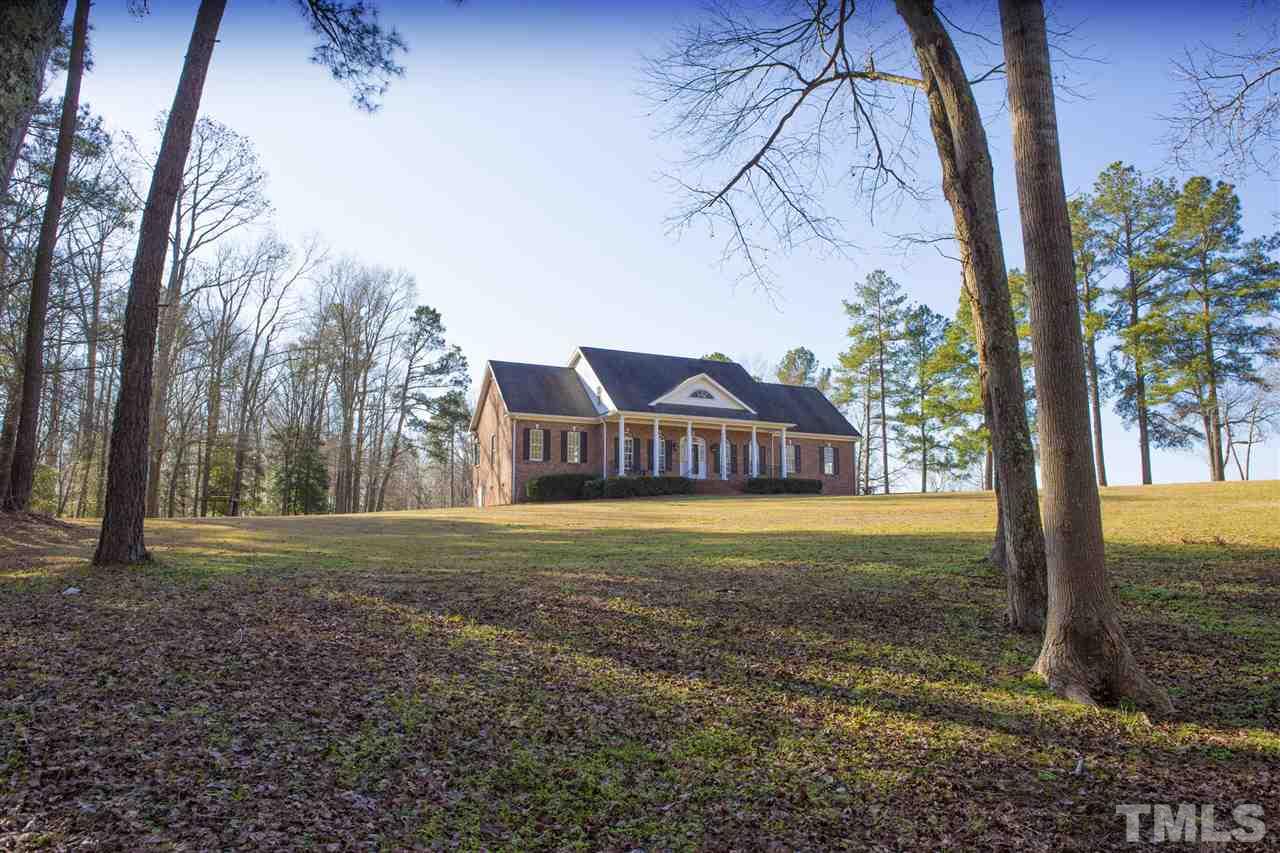 6407 Wimberly Road Willow Spring, NC 27592 - Photo 2 of 25 a view of a house with a yard
