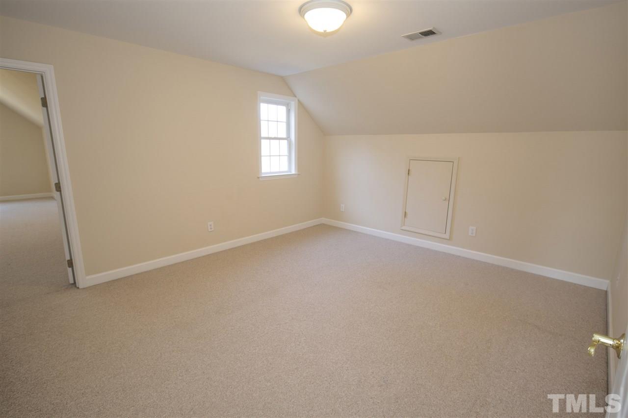 6407 Wimberly Road Willow Spring, NC 27592 - Photo 22 of 25 an empty room with windows and closet