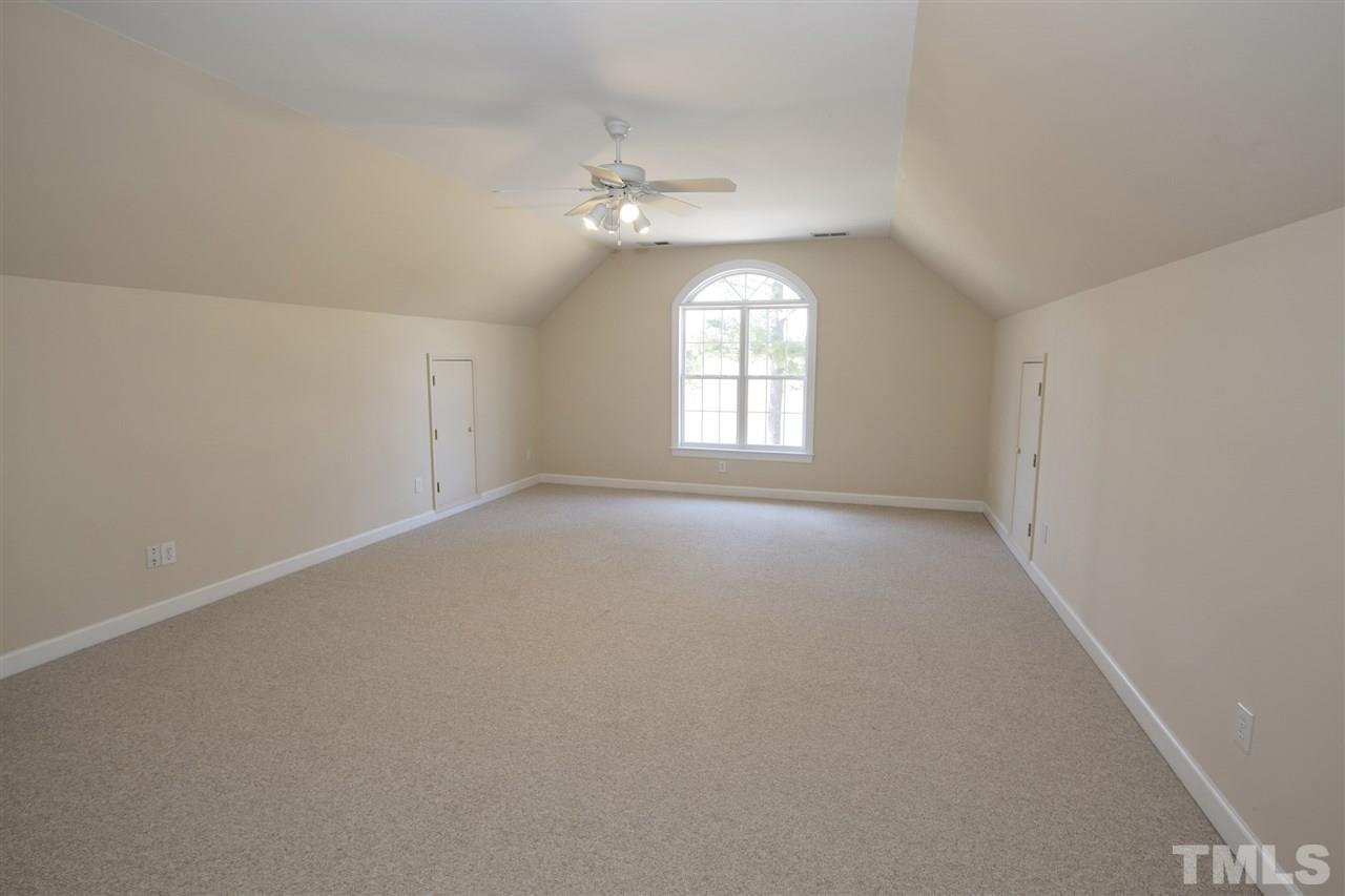 6407 Wimberly Road Willow Spring, NC 27592 - Photo 23 of 25 wooden floor in an empty room with a window