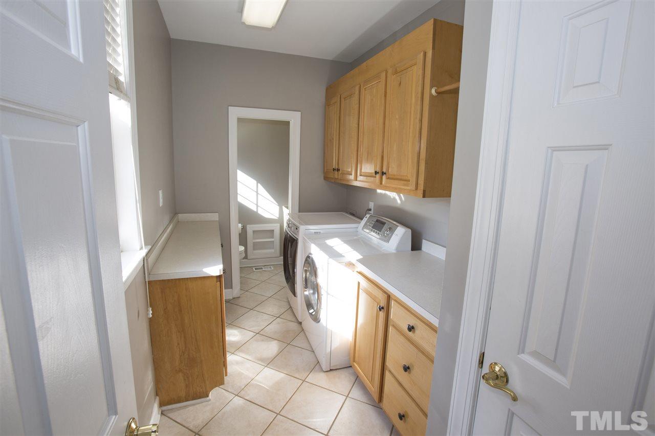 6407 Wimberly Road Willow Spring, NC 27592 - Photo 24 of 25 a bathroom with a sink and a mirror