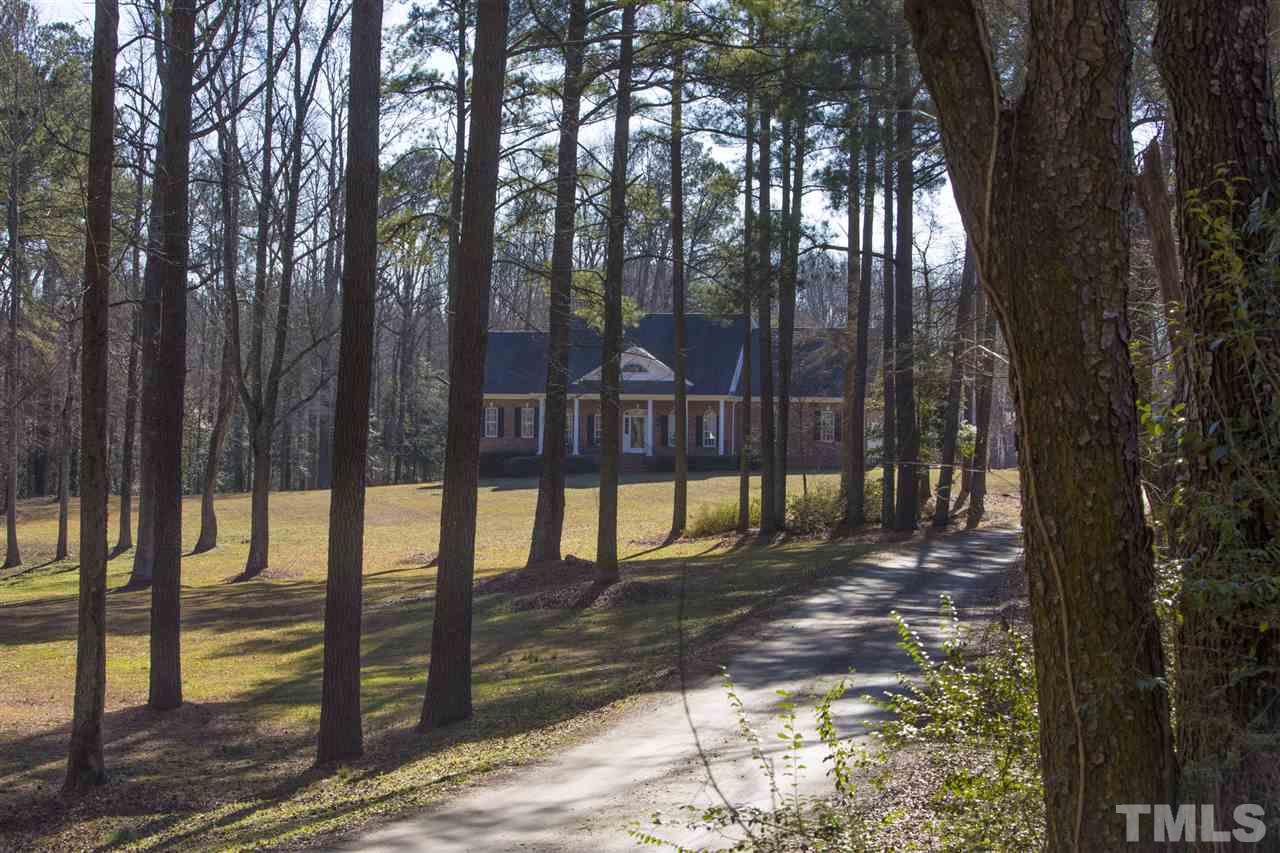 6407 Wimberly Road Willow Spring, NC 27592 - Photo 25 of 25 a view of a street with large trees