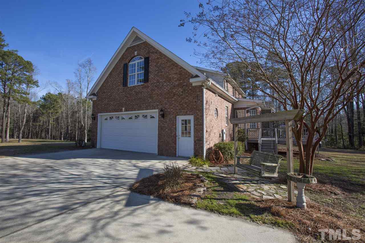 6407 Wimberly Road Willow Spring, NC 27592 - Photo 5 of 25 a front view of a house with a yard