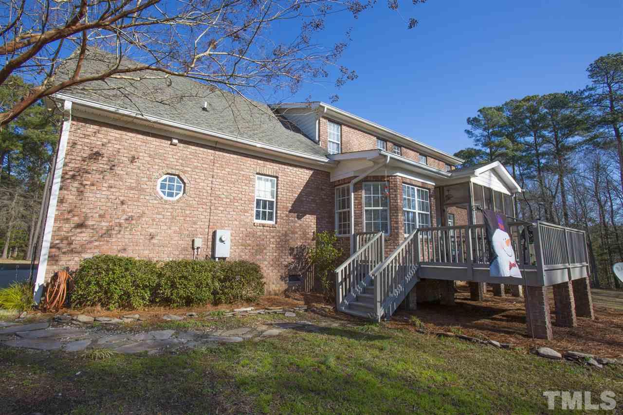 6407 Wimberly Road Willow Spring, NC 27592 - Photo 6 of 25 a view of a house with a yard