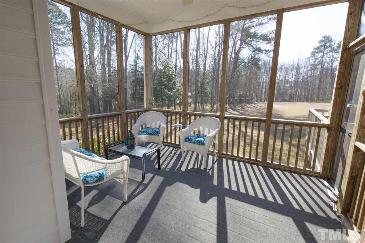 6407 Wimberly Road Willow Spring, NC 27592 - Photo 8 of 25 a view of a chair in wooden deck