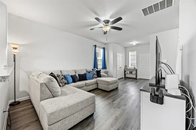 a kitchen with sink stove and refrigerator