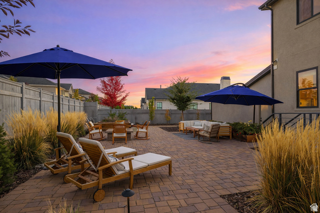 11617 South Wildrye Field Way Draper, UT 84020 - Photo 43 of 53 Patio terrace at dusk with outdoor seating, a patio area, and a fenced backyard