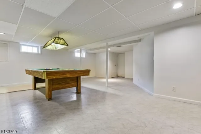 a view of game room with windows