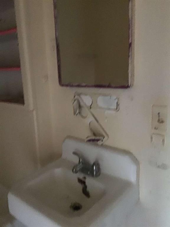 1847 Cook Street Shreveport, LA 71101 - Photo 16 of 38 a bathroom with a sink