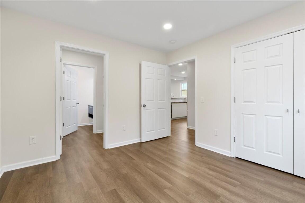 138 Pierce Avenue Pulaski, VA 24301 - Photo 26 of 40 a view of an empty room with wooden floor and a window