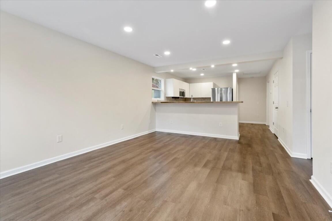 138 Pierce Avenue Pulaski, VA 24301 - Photo 4 of 40 a view of kitchen and wooden floor