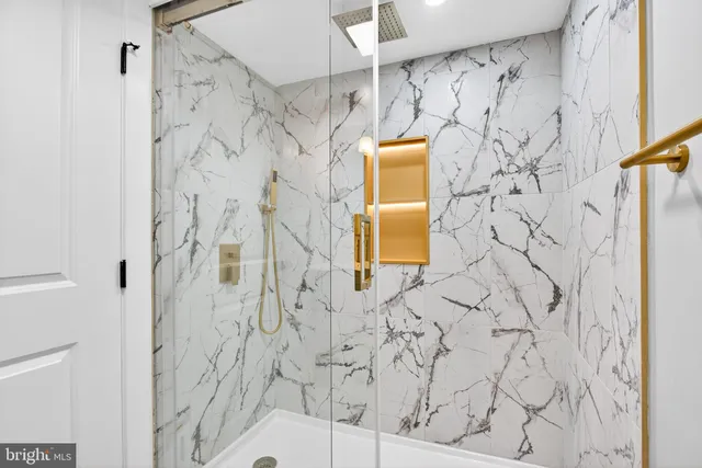 a bathroom with a shower curtain and a shower curtain