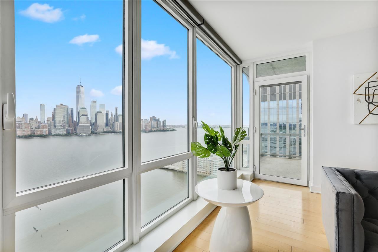 2 2nd Street, Unit 2803 Jersey City, NJ 07302 - Photo 4 of 28 a view of a living room and a balcony