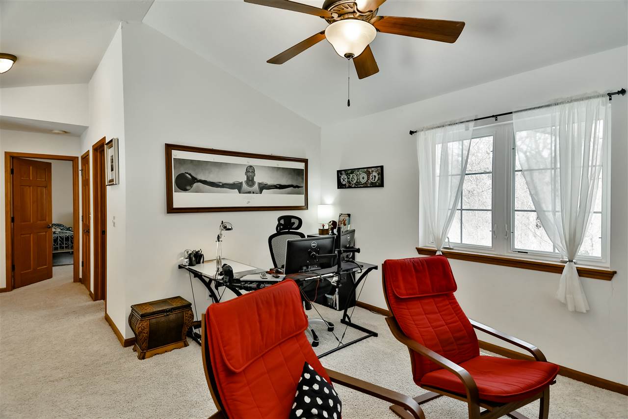 312 Rochester Road Northeast Poplar Grove, IL 61065 - Photo 22 of 28 a room with furniture and windows