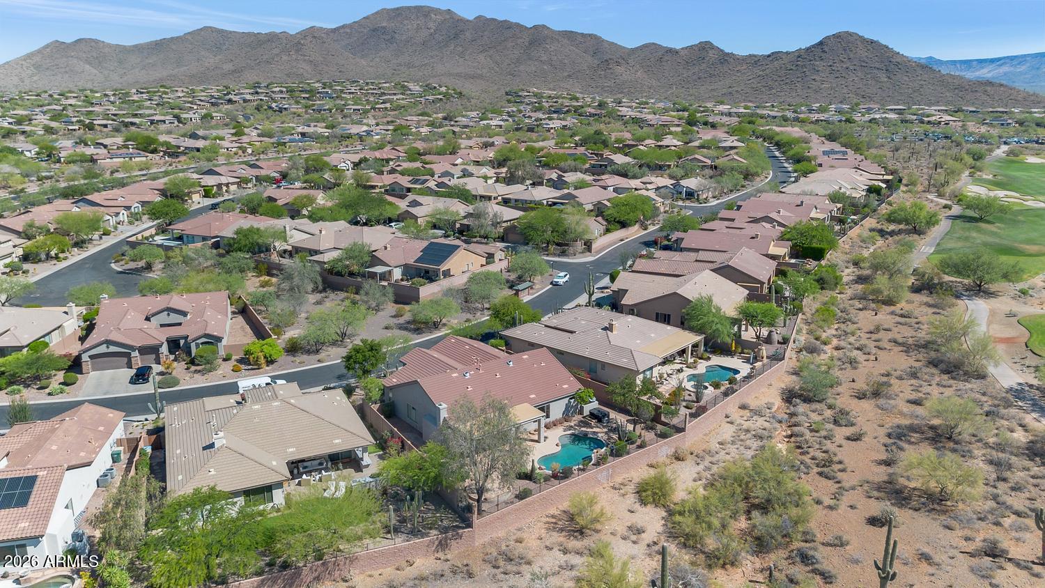 41123 North River Bend Road Phoenix, AZ 85086 - Photo 29 of 45 an aerial view of a city with lots of residential buildings and mountain view in back
