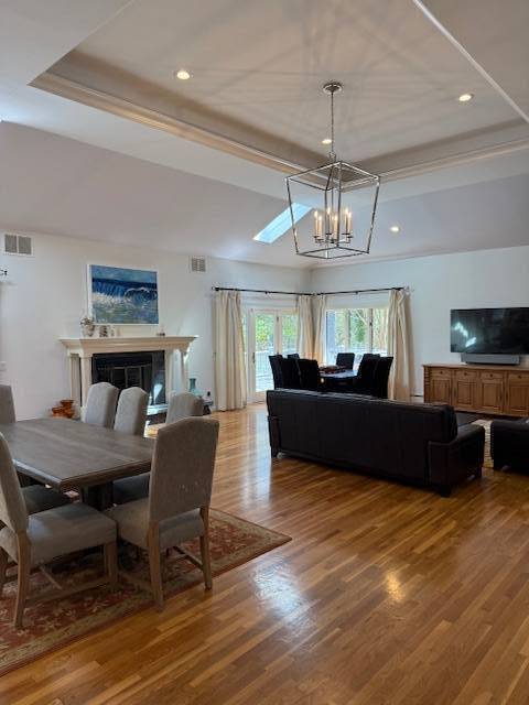 3 Stone Lane Quogue, NY 11959 - Photo 13 of 35 a living room with furniture and a chandelier