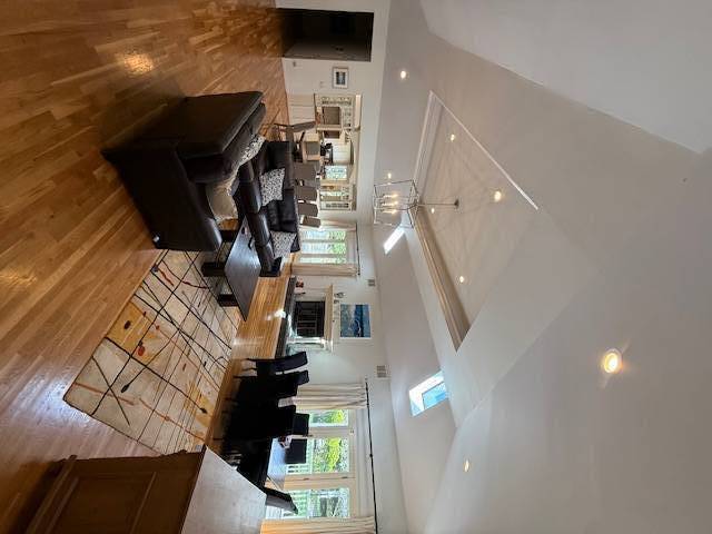 3 Stone Lane Quogue, NY 11959 - Photo 18 of 35 a view of entryway and hall with wooden floor