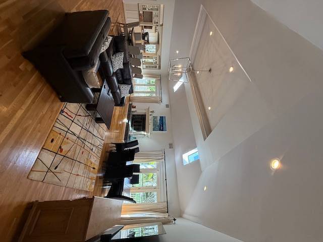 3 Stone Lane Quogue, NY 11959 - Photo 19 of 35 a view of entryway and hall with wooden floor