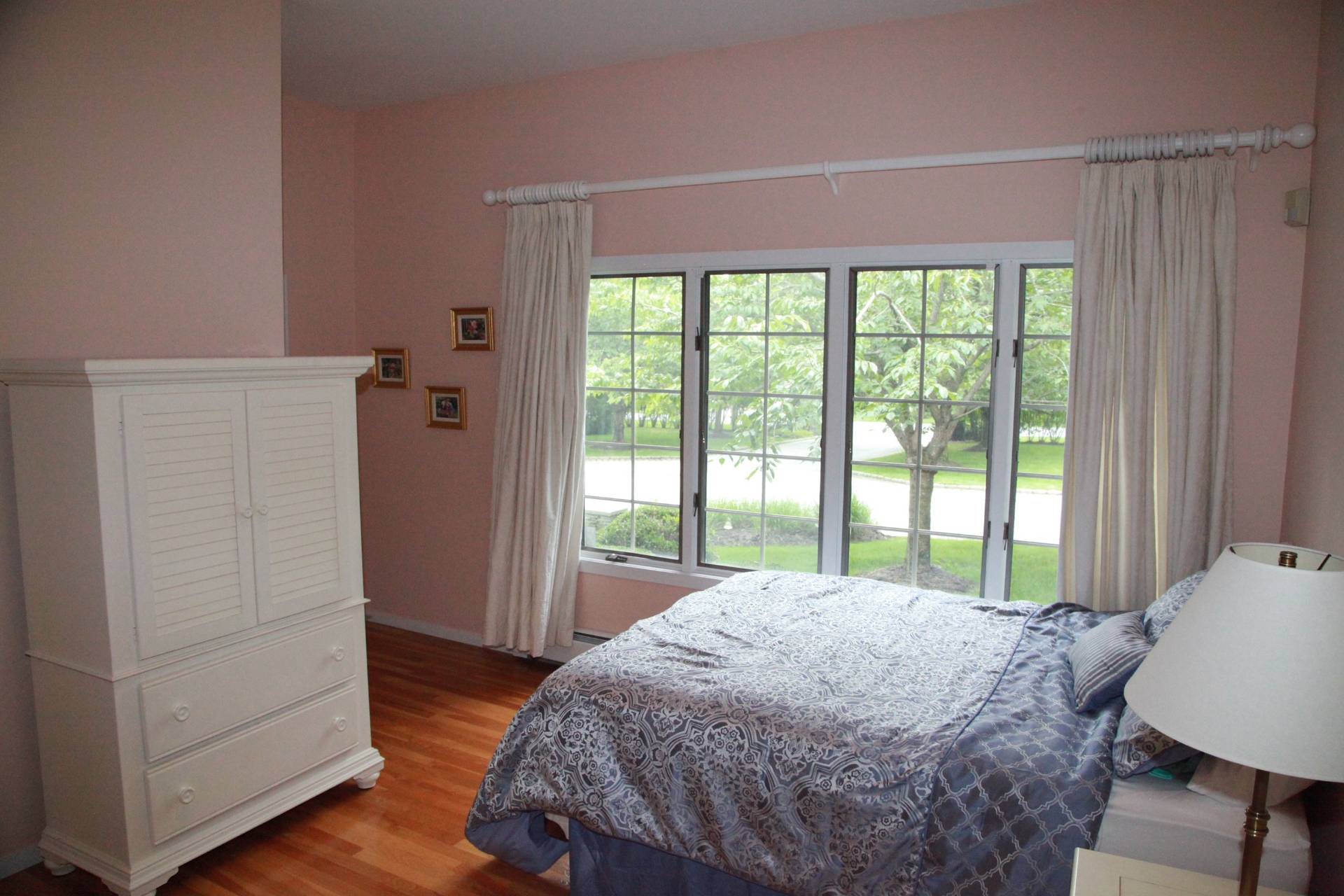 3 Stone Lane Quogue, NY 11959 - Photo 2 of 35 a bed sitting in a bedroom next to a window