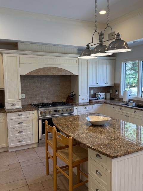 3 Stone Lane Quogue, NY 11959 - Photo 29 of 35 a kitchen with granite countertop a sink and a stove
