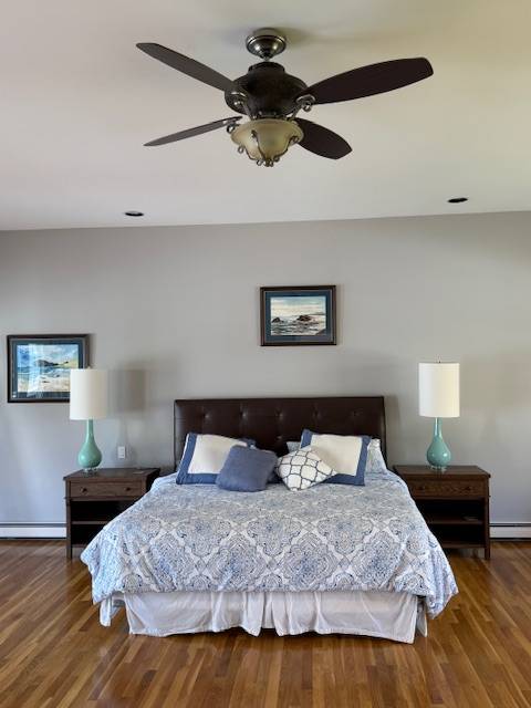 3 Stone Lane Quogue, NY 11959 - Photo 31 of 35 a bedroom with a bed and wooden floor