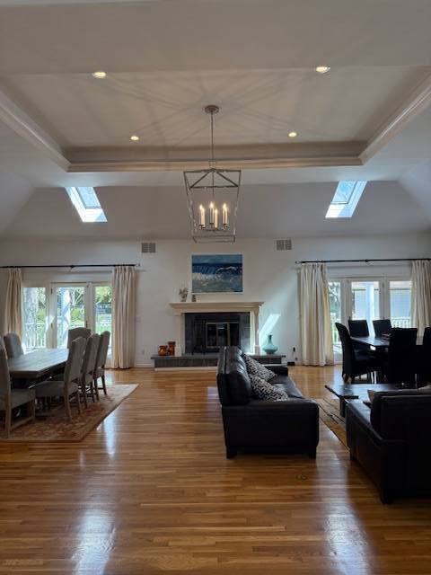 3 Stone Lane Quogue, NY 11959 - Photo 32 of 35 a living room with furniture kitchen view and a wooden floor
