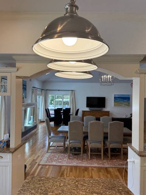3 Stone Lane Quogue, NY 11959 - Photo 33 of 35 a living room with furniture a rug and a chandelier