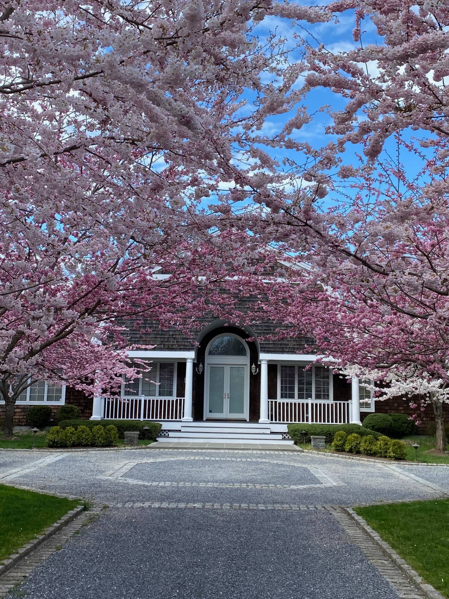 3 Stone Lane Quogue, NY 11959 - Photo 7 of 35 a front view of a house with a garden